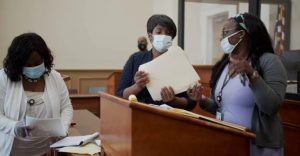 Assistant City Attorney/Prosecutor Kimberly Walker Nailor, center, confers with social worker Linda Sweezer, left, and court administrator Kayla Hudson during an October 2021 session of domestic violence center in Vicksburg, Miss. Credit: Blair Ballou/MCIR