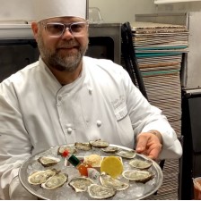 EXECUTIVE CHEF KRISTIAN WADE OF THEBEAU RIVAGE PREPARES OYSTERS FOR
CUSTOMERS