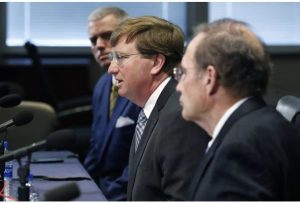 Gov. Tate Reeves, center, speaks in 2020 of how he and House Speaker Philip Gunn, R-Clinton, left, and Lt. Gov. Delbert Hosemann, right, are working on a deal about how to spend $1.2 billion in CARES Act funds. Although party mates, the three disagreed about who had spending authority over the CARES Act funds. (AP Photo/Rogelio V. Solis, File)