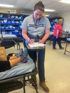 chool of Medicine graduate and emergency medicine physician Dr. Margaret Shepherd treats a storm victim at a triage center set up in Rolling Fork.