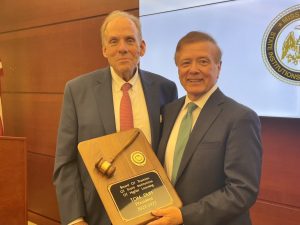 Trustee Martin presents plaque to Trustee Duff