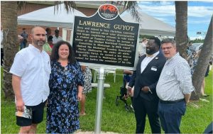 Lawrence Guyot's daughter, Julie Guyot-Diangone, along with John Spann and Dr. Stuart Rockoff of the Mississippi Humanities Council at the unveiling of the Freedom Trail Marker in Pass Christian.