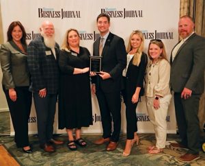 Itawamba Community College’s representatives accepting the Mississippi Business Journal award include from left, Nina Strother, director of Marketing and Community Engagement; Tim Clouse, division chair, Criminal Justice; Dr. Michelle Clouse, vice president of Instructional Services; Tim Senter, vice president of Human Resources and Administration; Taylor Tutor, coordinator of Student Activities; Maggie Caldwell, marketing specialist; and Chris Stevenson, dean of Academic Instruction.