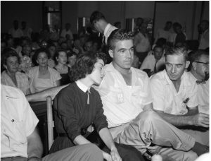 In this Sept. 22. 1955 photo, Carolyn Bryant rests her head on her husband Roy Bryant's shoulder after she testified in Emmett Till murder court case in Sumner, Miss. Stymied in their calls for a renewed investigation into the murder of Emmett Till, relatives and activists are advocating another possible path toward accountability in Mississippi: They want authorities to launch a kidnapping prosecution against the woman who set off the lynching by accusing the Chicago teen of improper advances in 1955. (AP Photo, File)