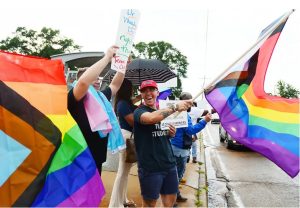 Jason McCarty, Capital City Pride Executive Director (center) and Eleven Cook, were among a group of demonstrators protesting the University of Mississippi Medical Center's decision to close TEAM Clinic that provided care for the LGBTQ+ community, Tuesday, June 6, 2023 in Jackson. Credit: Vickie D. King/Mississippi Today