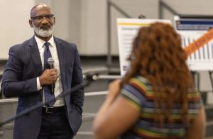 Superintendent of Jackson Public Schools Errick Greene listens as a student expresses her concerns about school closures during a JPS community meeting at Forest Hill High School in Jackson, Miss., Monday, Oct. 9, 2023. JPS announced its plan to close or consolidate 16 schools. Credit: Eric J. Shelton/Mississippi Today